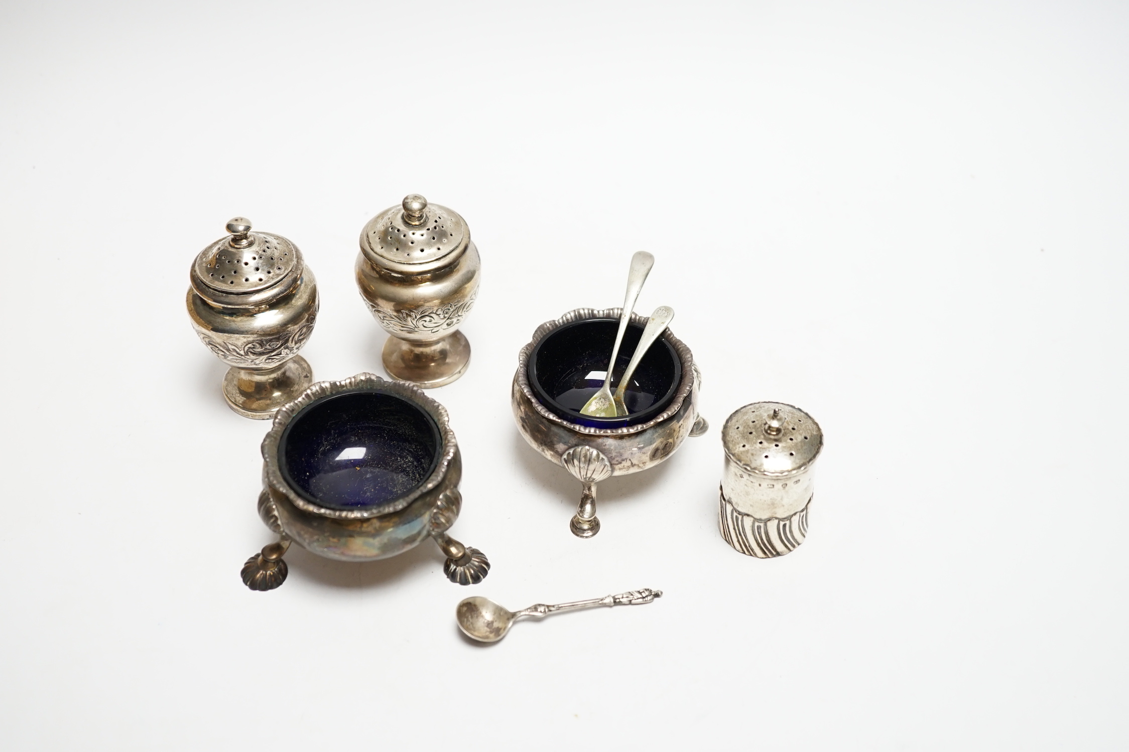 Two Georgian silver bun salts and three other silver condiments.